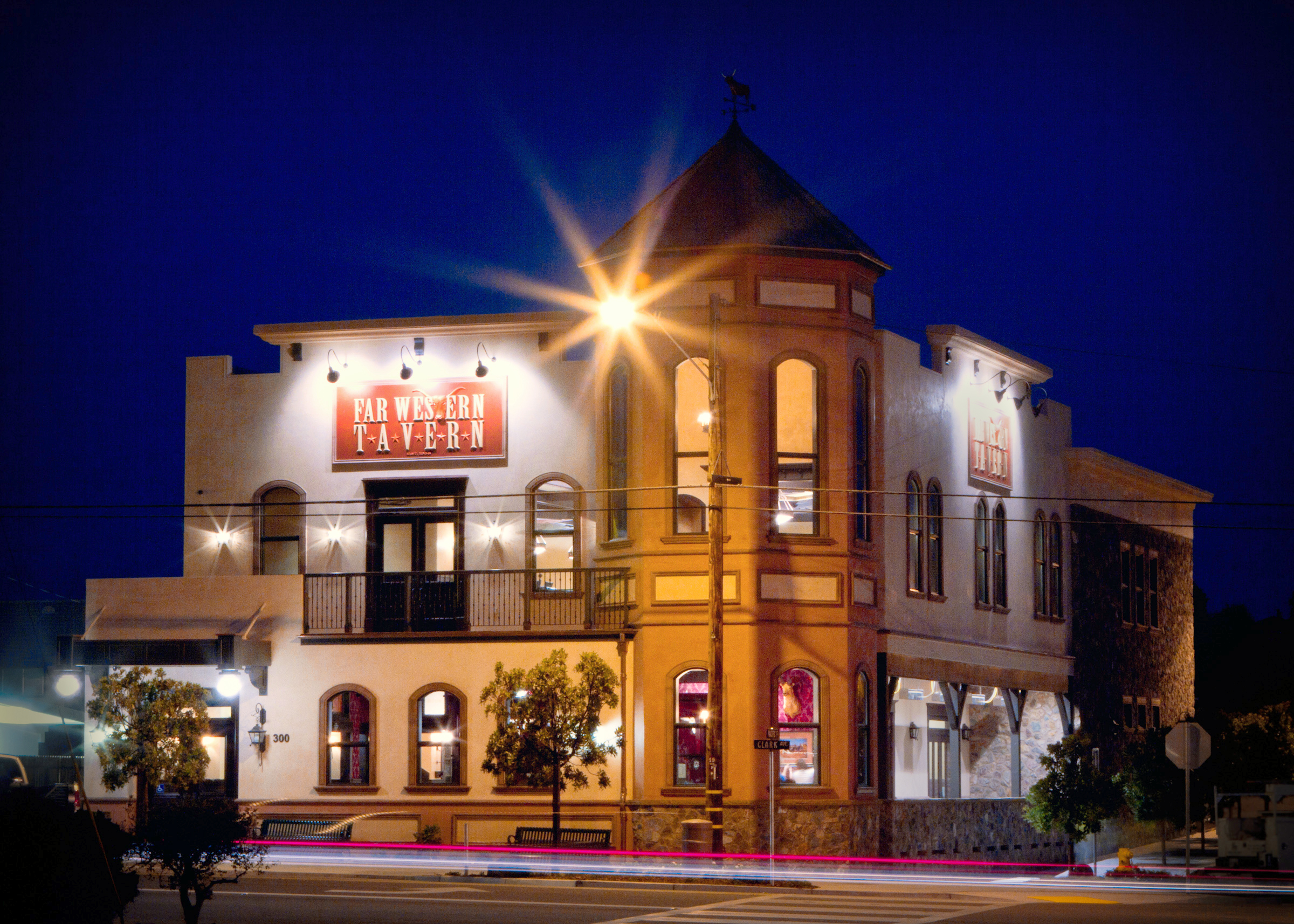 Far Western Tavern under the enchanting glow of evening lights, welcoming patrons to a unique dining experience.